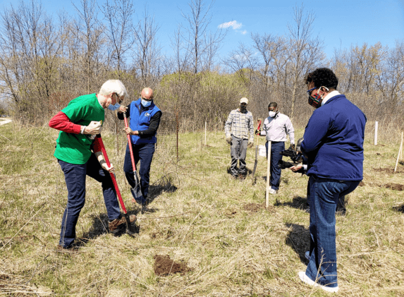 Just Transition & Equity | Wisconsin Governor Evers planting trees.